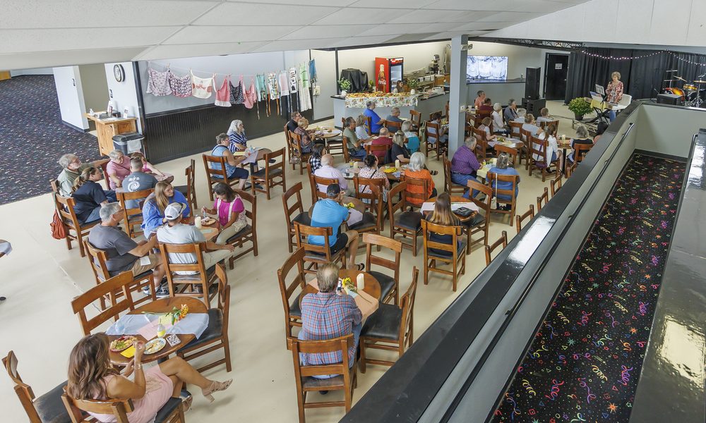 Guests dining by the catering annex and serving counter